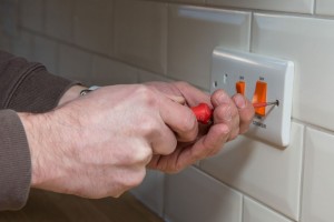 property-maintenance-man-fixing-socket-700x467